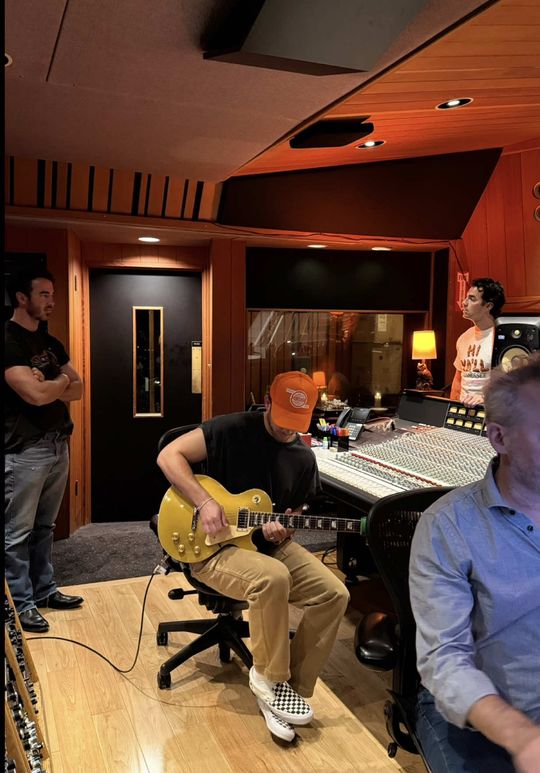 We got back in the studio with our early days producer John